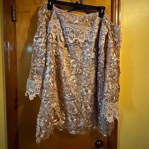 Rose colored sequin dress off the shoulder .